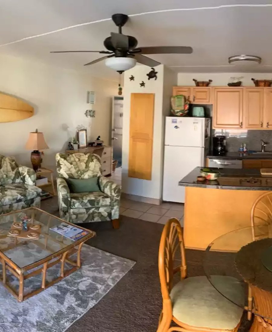 The living room of the condo with the lanai doors open